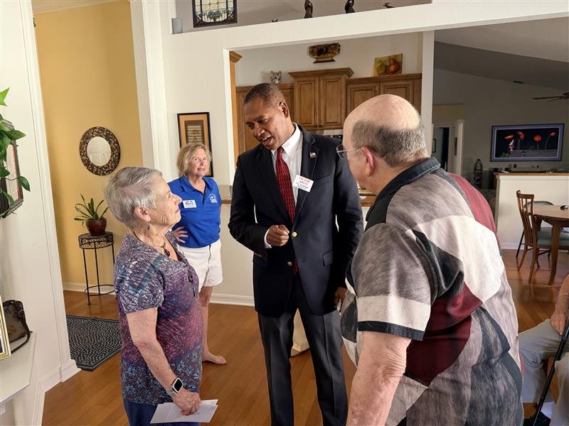 Victor Arias meeting with constituents in their home